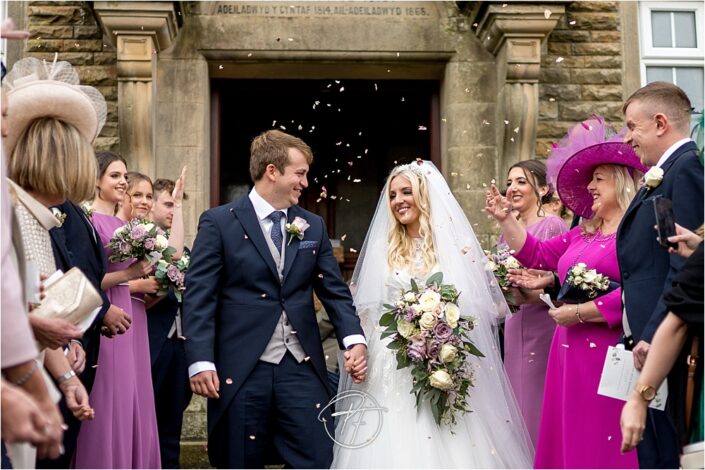 after the ceremony, the bride and groom often leave for a confetti line to be cheered on by guests