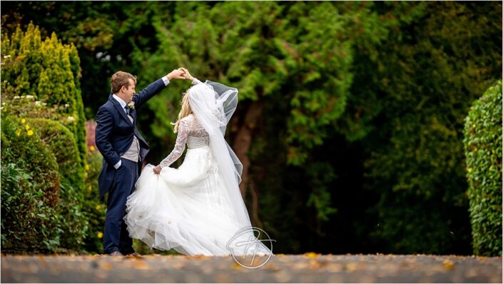 Bride and groom practicing their first dance at Mansion House in Llansteffan