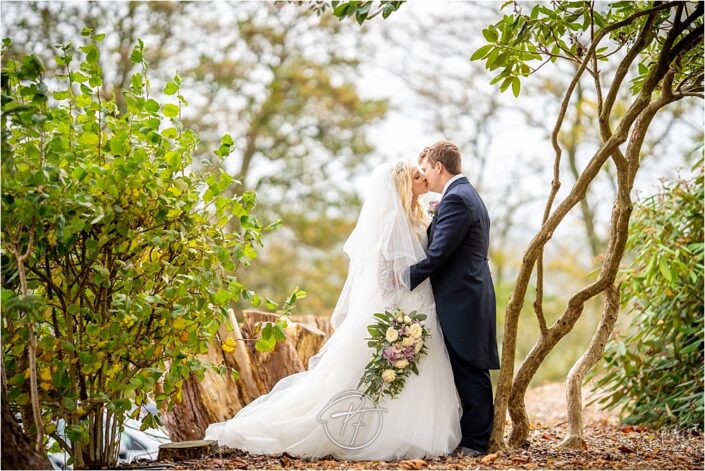 Bride and Groom in front of trees