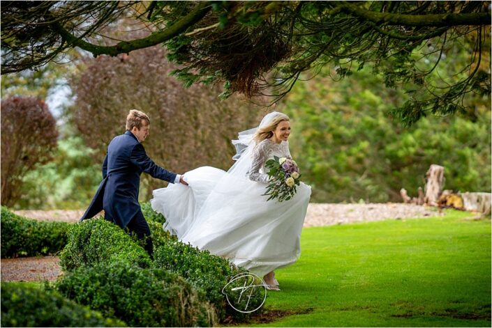 Bride and Groom Walking in the Wind