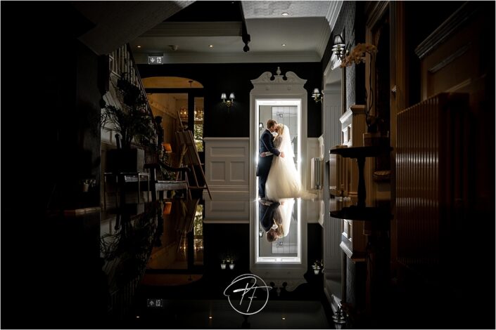 Reflection with bride and groom in creative wedding photo