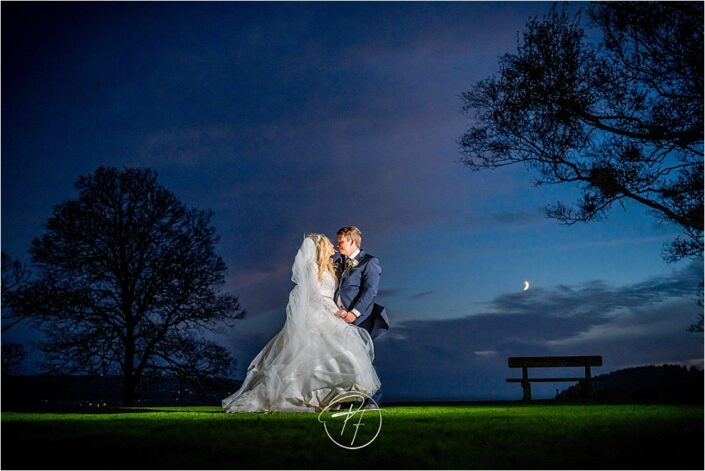 bride and groom in moonlight