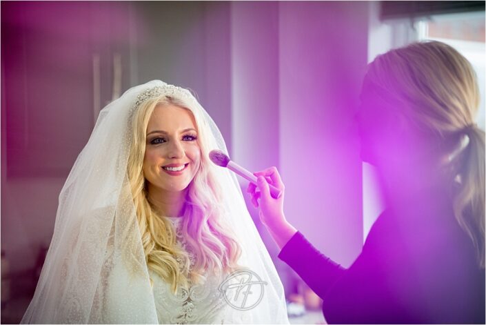 artistic photo of bride getting ready