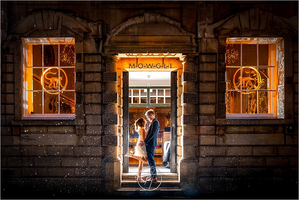 Wedding photography in Bristol City Centre in the rain with Hannah and Joe outside Mowgli at night